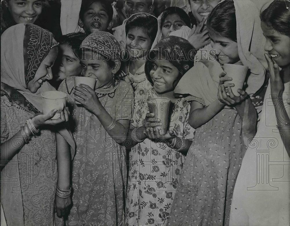 1960 Pakistani School Students Share Drink Of Milk  - Historic Images