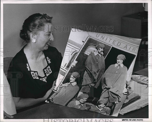1960 Ellen Church with the photo of her first flight  - Historic Images