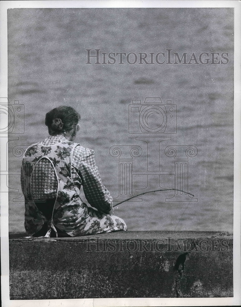 1960 Lake Moxie, Maine, a lady fishing on the lakefront  - Historic Images