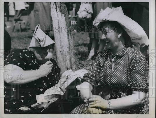 1958 Epsom, England, Ladies at the track in strange hats  - Historic Images