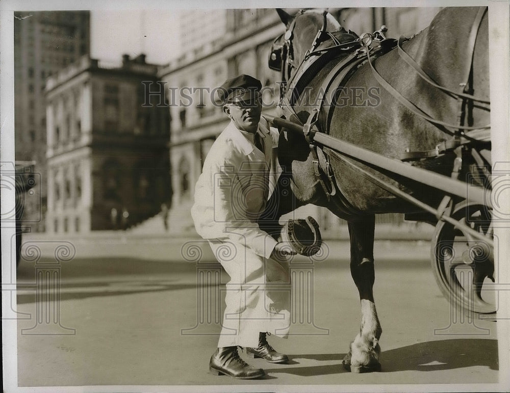 1935 Press Photo Milk Man Showing Hooves on Wagon Horse - nea79664 - Historic Images