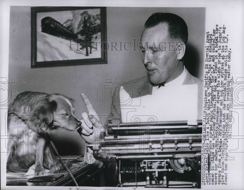 1957 Oakland, Calif. Larry Wright of S Pacific RR &amp; toy shepherd - Historic Images