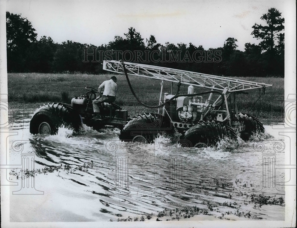 View Of Man Riding Machine In Water  - Historic Images