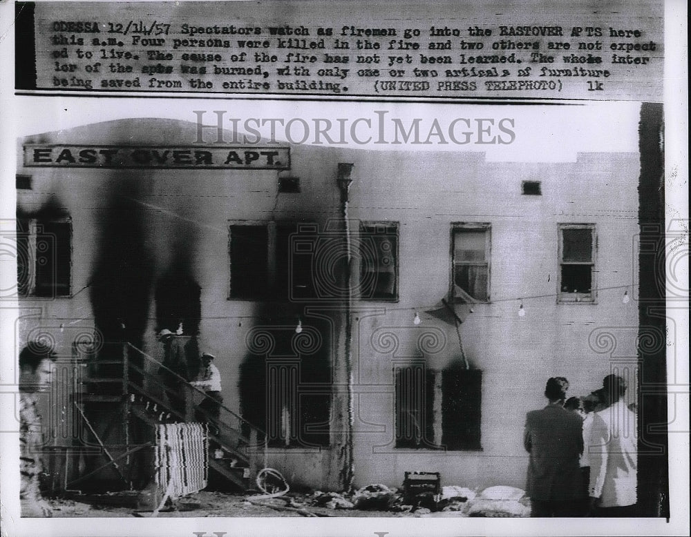 1957 Spectators Watch Fireman go into burning building  - Historic Images