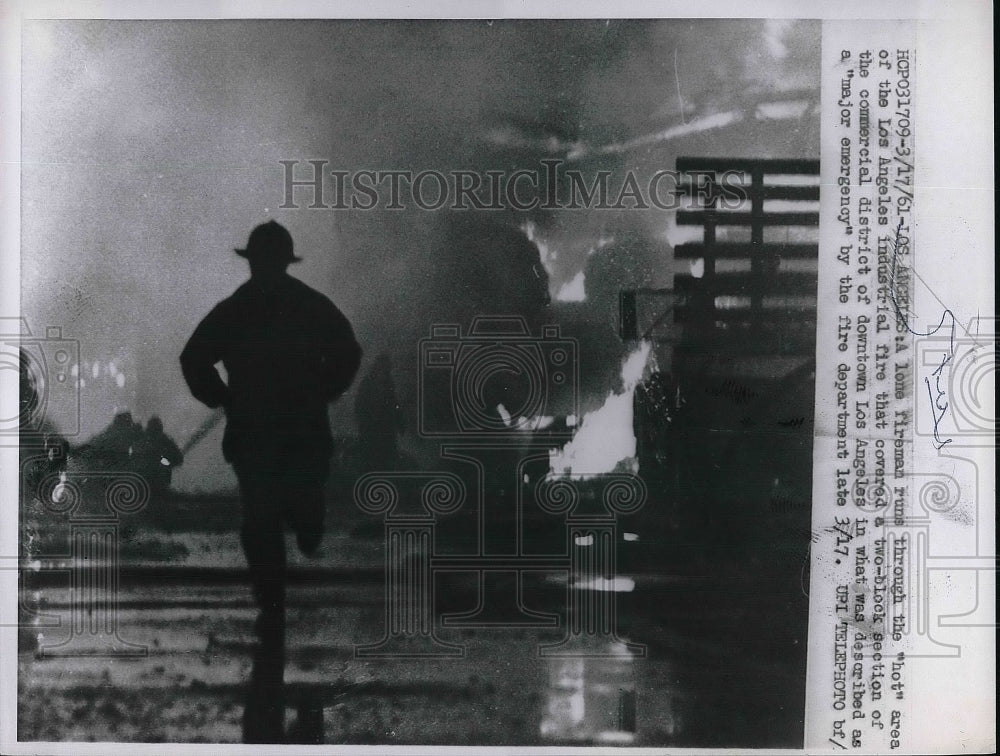 1961 Fireman fighting fire in Los Angeles  - Historic Images