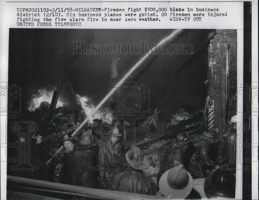 1958 Press Photo Firemen fighting a business fire - nea81142 - Historic Images