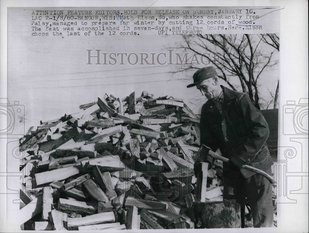 1960 Press Photo Math Elson Cuts Wood To Prepare For Winter - nea81181 - Historic Images