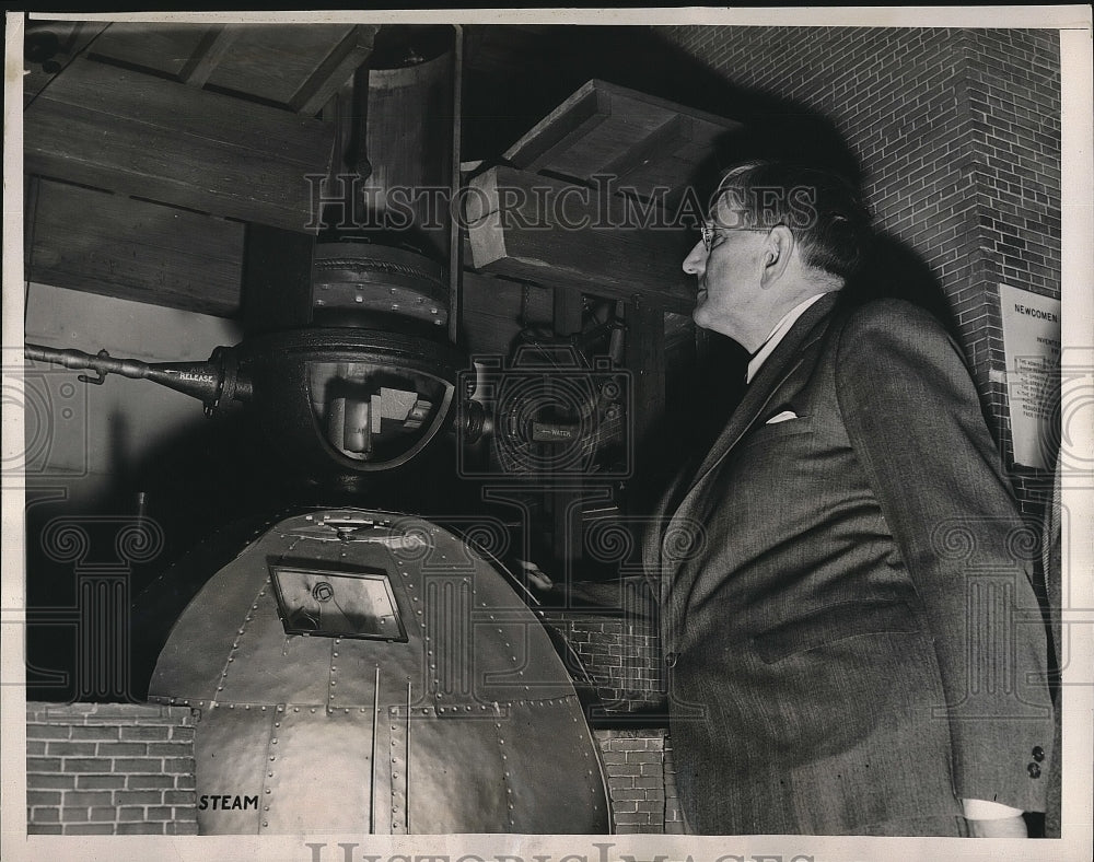 1939 Clyde B. Aithison Inspects Model of First Engine  - Historic Images