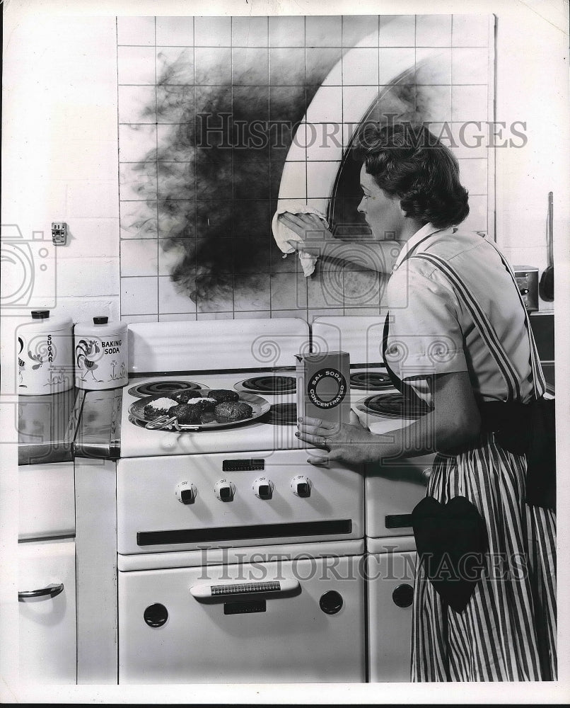 1955 Model Homemaker Using Cleaner for Smoke Residue Advertisement - Historic Images