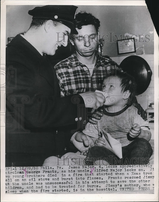 1953 James Major Looks at Patrolman George Frantz After Fire Rescue - Historic Images