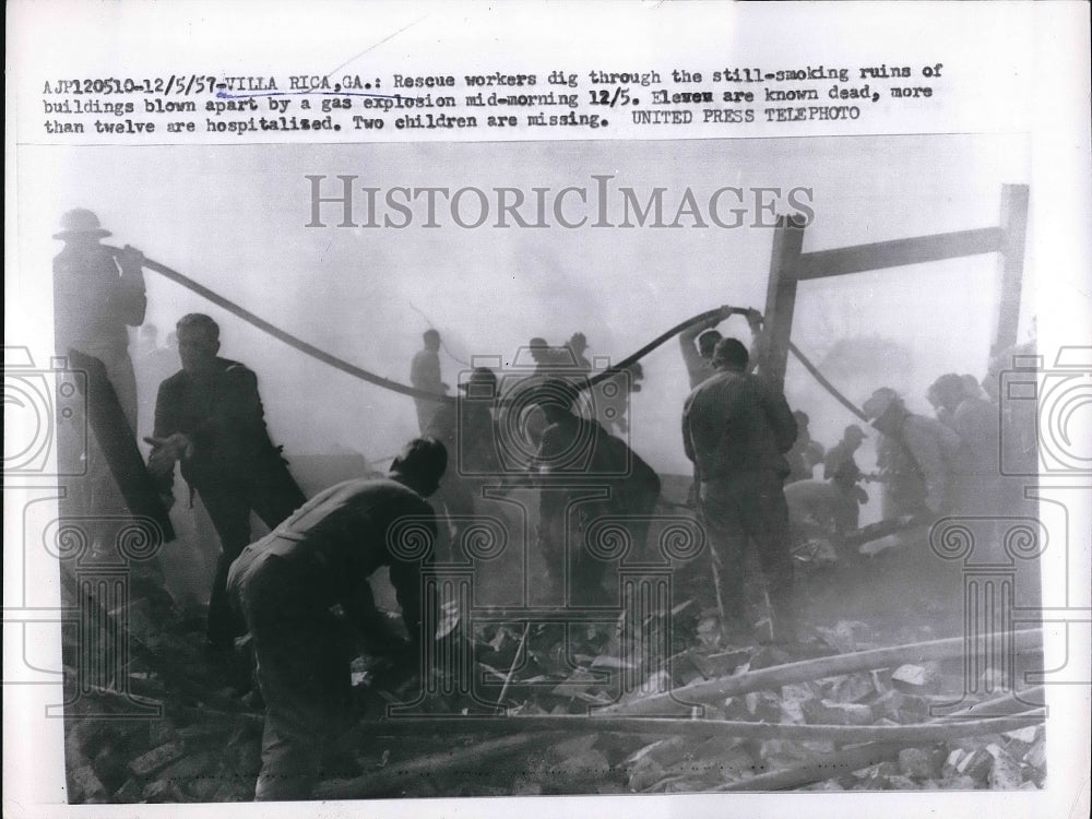 1957 Workers clearing out building after explosion  - Historic Images