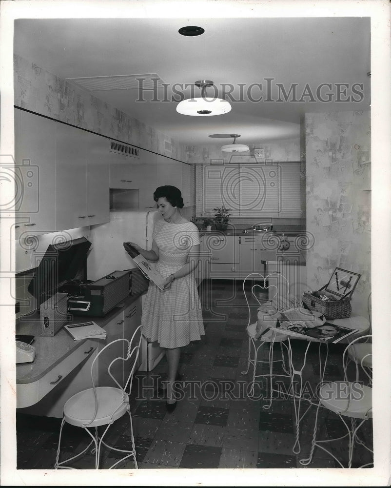 1961 A the woman working in her kitchen  - Historic Images