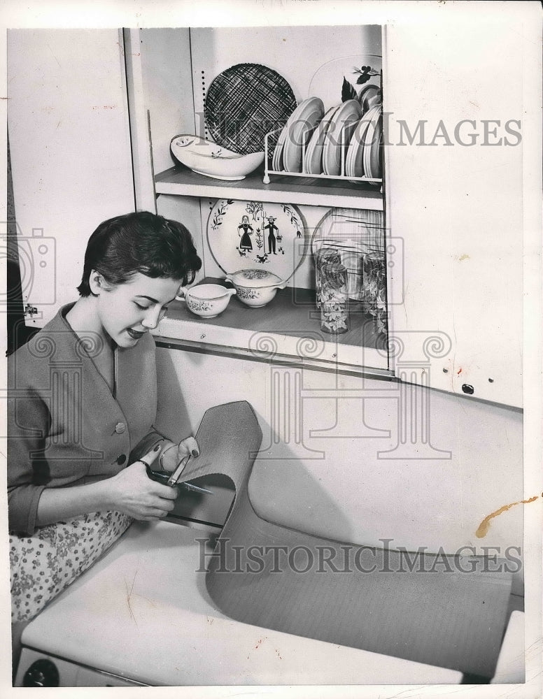 1954 the woman getting ready to sew  - Historic Images