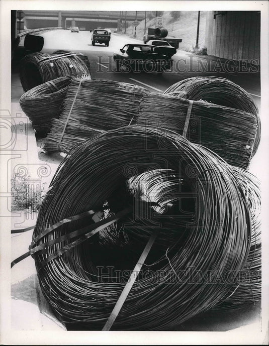 1971 Rolls of steel pulled off of the truck  - Historic Images