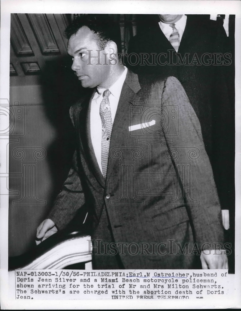 1956 Miami Policemen Earl M.Ostreicher arrived at the trial of wife. - Historic Images