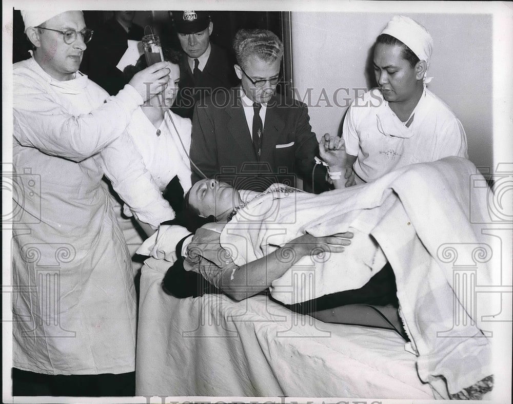 1954 Chicago Policeman John Loughlin Being Treated for Injuries - Historic Images