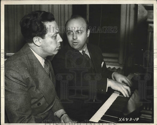 1935 Man Playing Piano With Another Man Singing  - Historic Images
