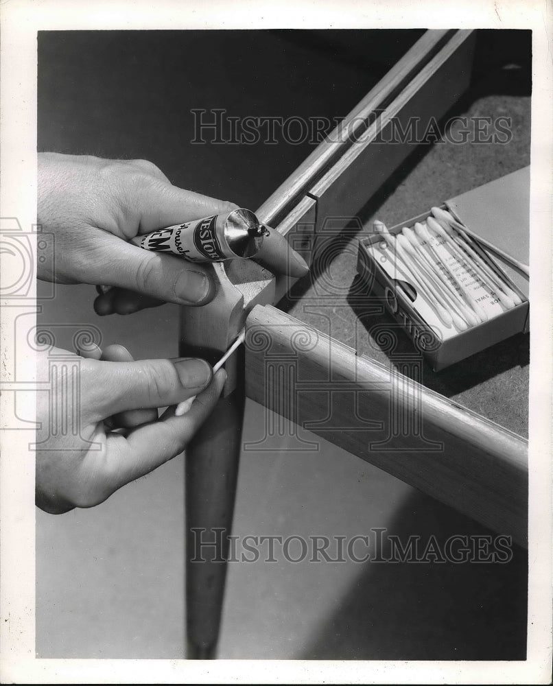 1969 Press Photo Cotton swabs fasten table leg with glue - nea83689 - Historic Images