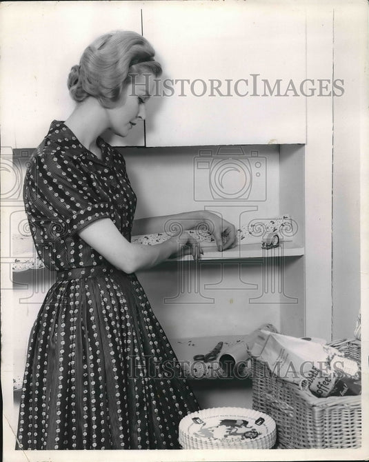1961 Keeping Freshly Cut Paper From Curling On Shelf With Tape - Historic Images