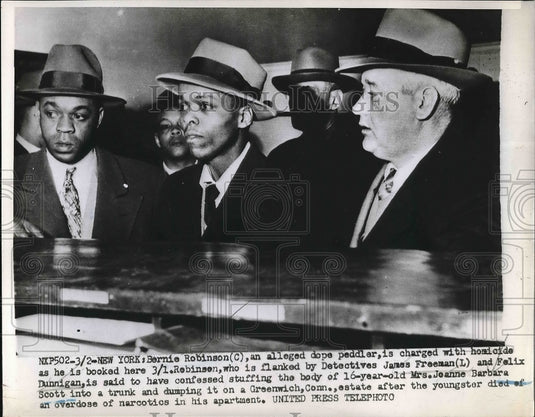 1952 Bernie Robinson being booked into jail  - Historic Images