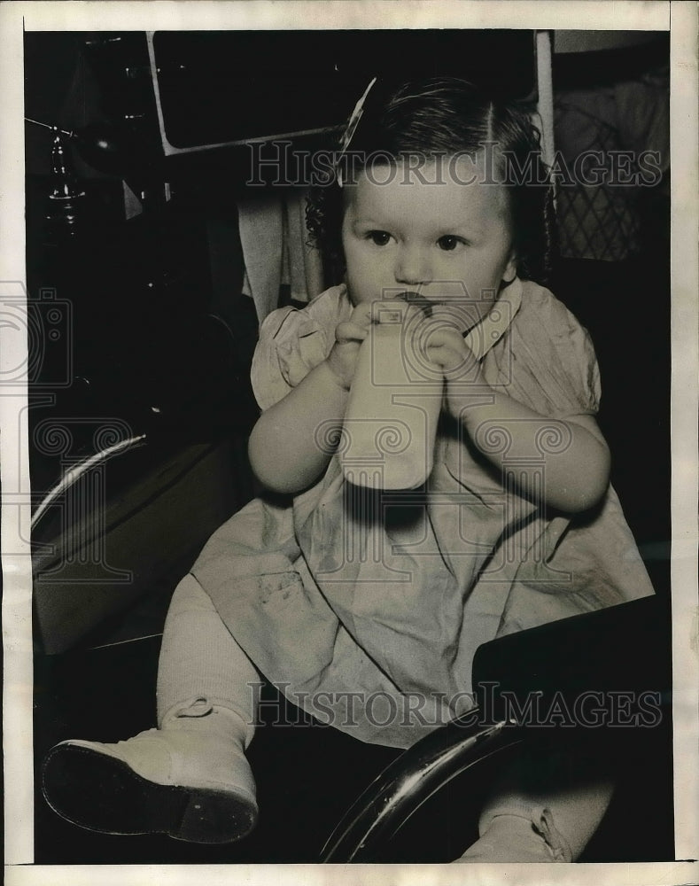 1938 Little Patricia and with her bottle  - Historic Images