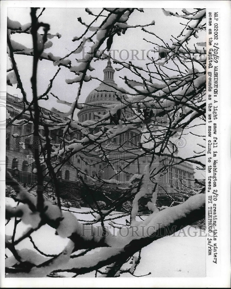 1969 Press Photo U.S. Capitol Hill Building covered with snow in Washington. - Historic Images