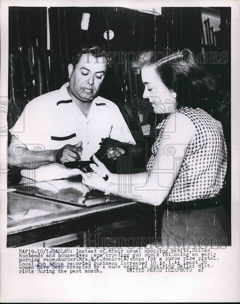 1953 Mrs HC Monico of Dallas, Tx shops for a gun  - Historic Images