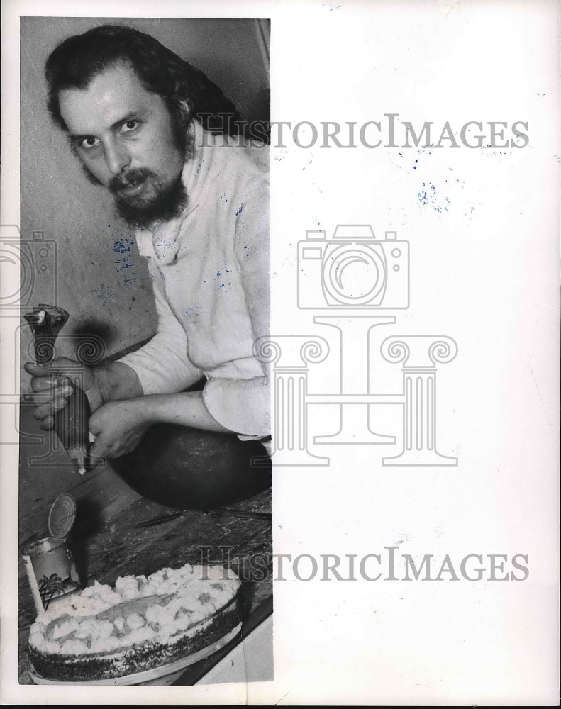 1950 Benedict Stueckl Jr, baking & decorating a cake  - Historic Images