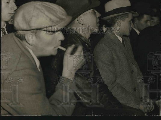 A group of men waiting for something  - Historic Images