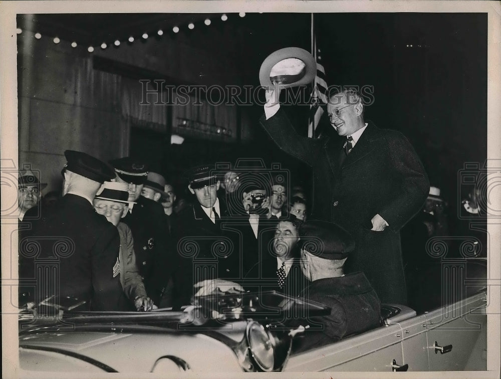 1936 Man in a car during a parade.  - Historic Images