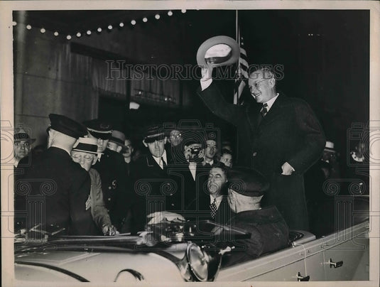 1936 Man in a car during a parade.  - Historic Images