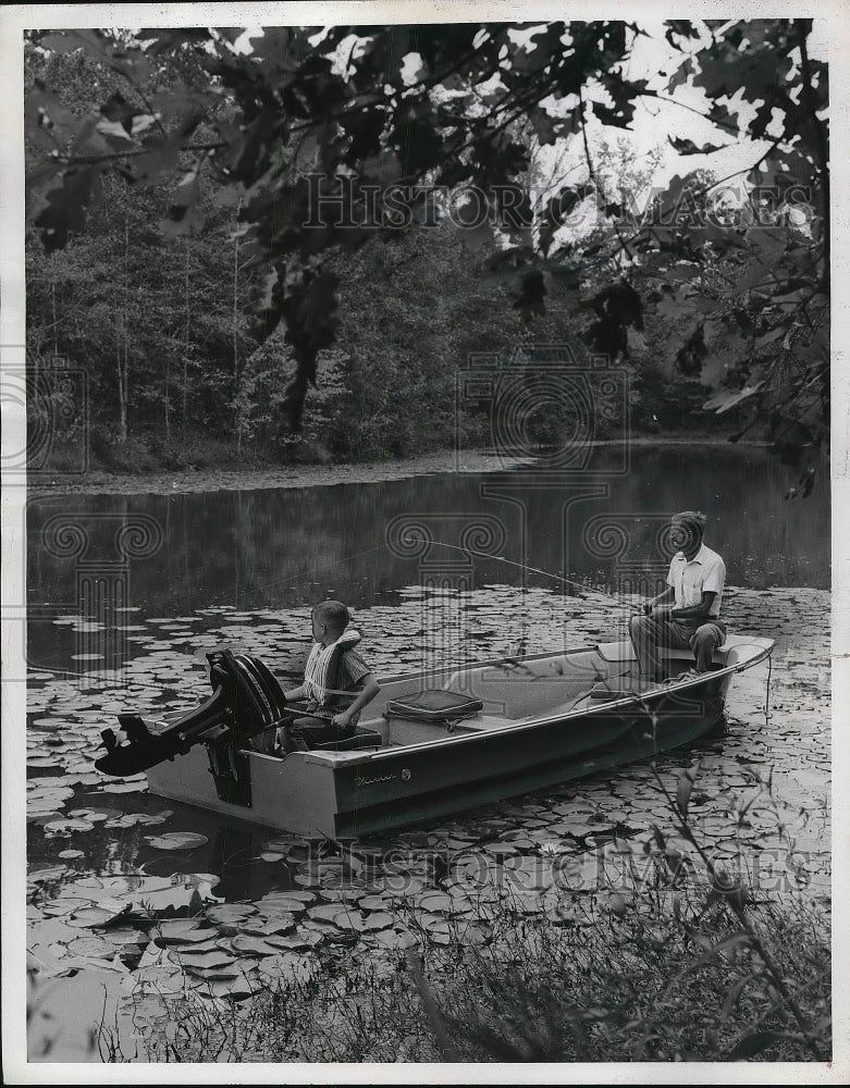 1964 Fisherman Wearing Life Jackets While Fishing In Boat - Historic Images