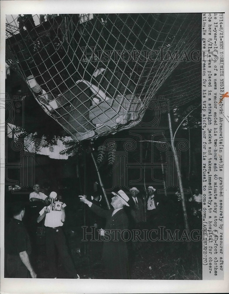 1950 Rescuers Grab Melvin Abramowitz After He Jumped From Atop Pole - Historic Images