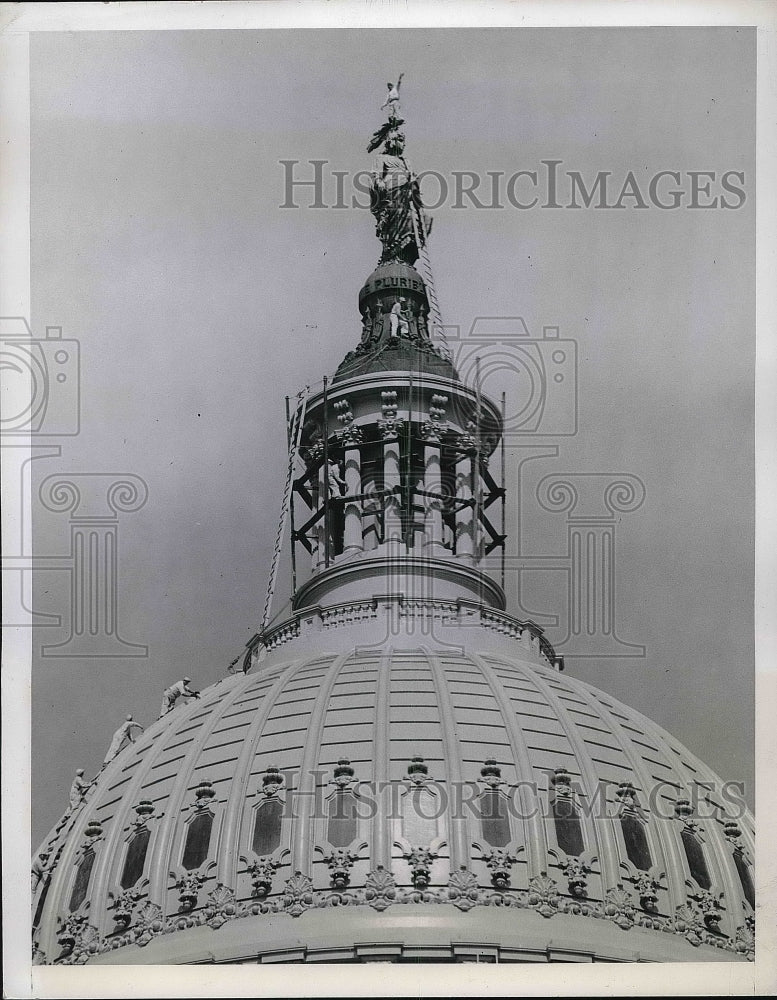 1944 Jack Toreyson atop statue on the Capitol Building  - Historic Images