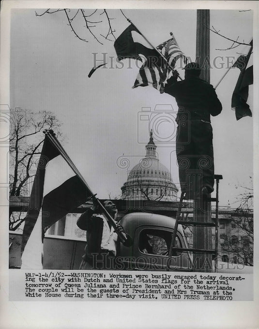 1962 Workers preparing for Queen Juliana and Prince Bernard to visit - Historic Images