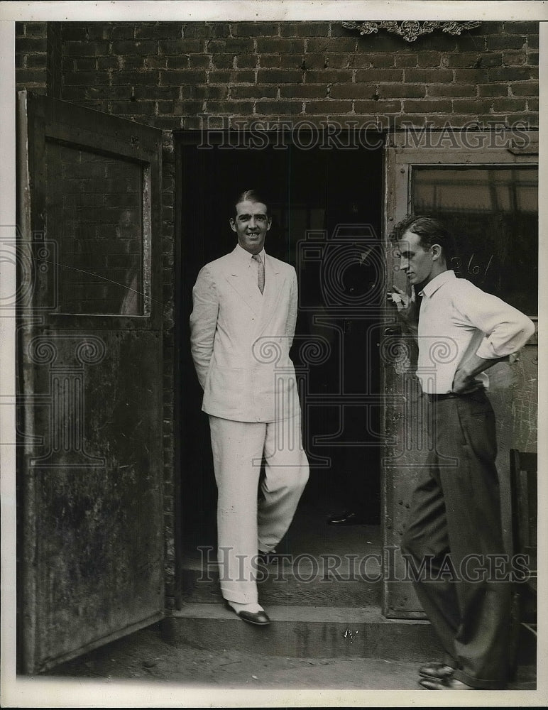 1934 Press Photo Robert D. Hooke leaving factory - nea86319 - Historic Images