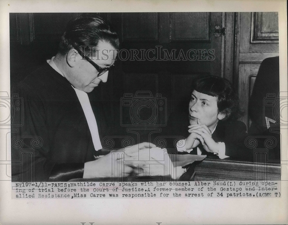 1949 Mathilde Carre speaks with her counsel Alber Naud during trial - Historic Images