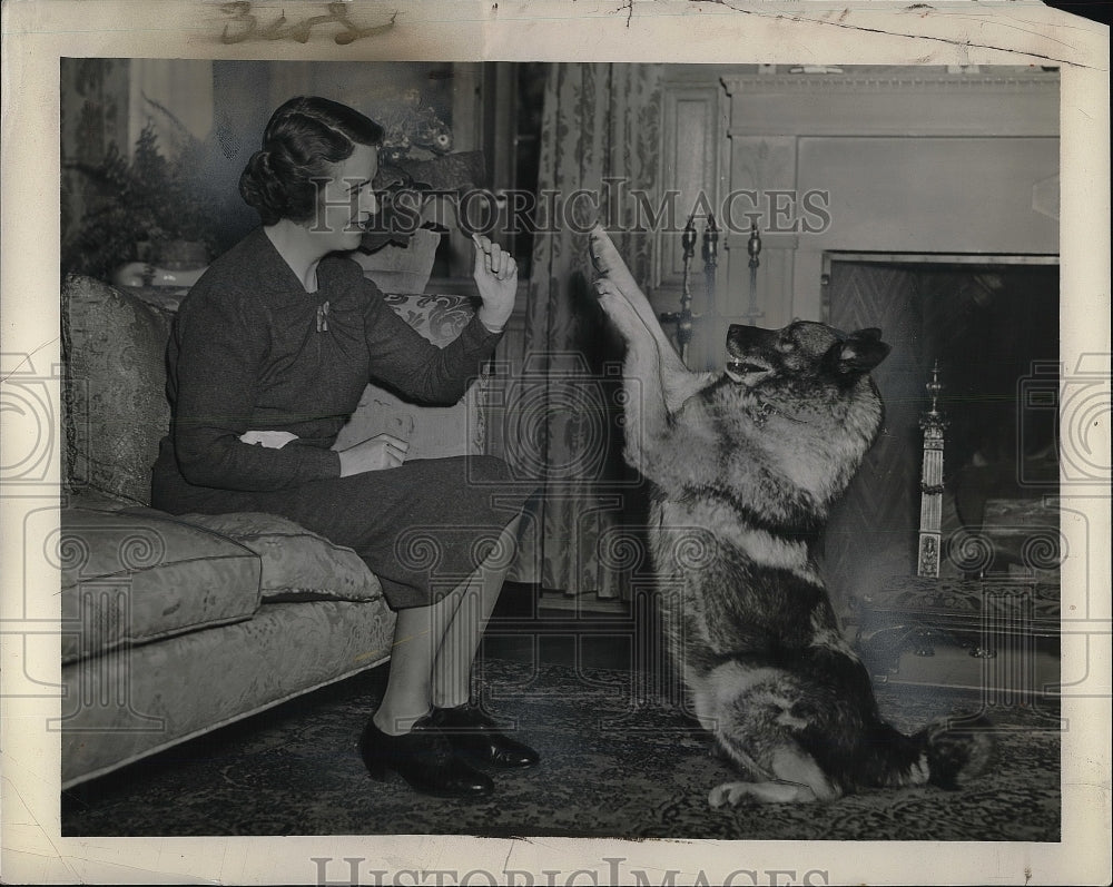 1939 Mrs. Thomas White with her Norwegian Elk hound  - Historic Images