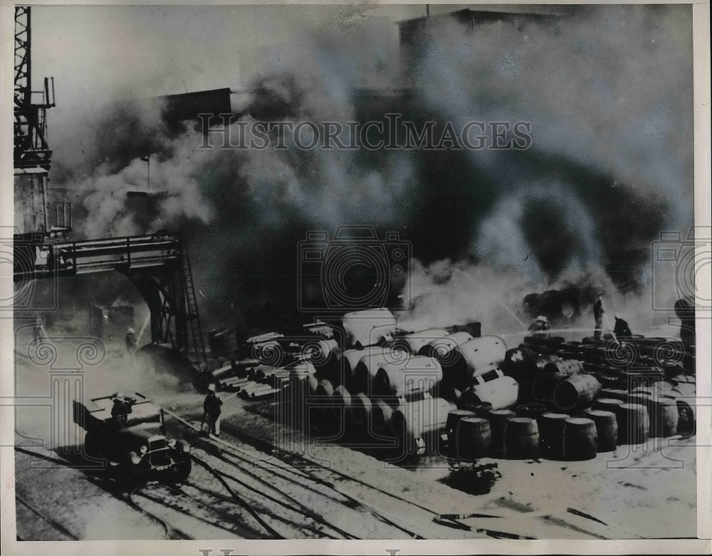 1939 Firemen trying to hault a fire in Algires after an explosion - Historic Images