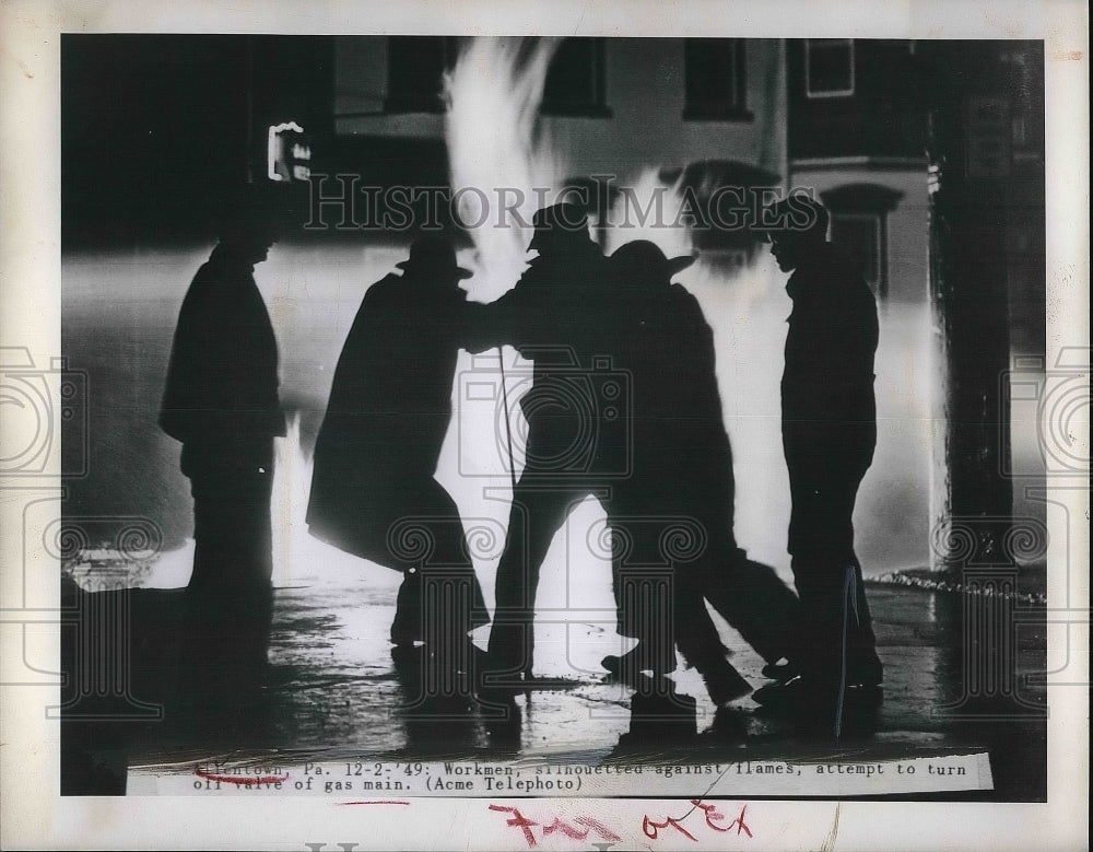 1949 Press Photo Workmen Attempt to Turn off Gas Main Silhouette in Flames - Historic Images