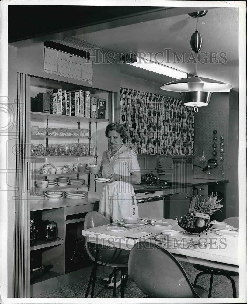 1956 Mrs Margaret West shows uses of a home kitchen at USDA - Historic Images