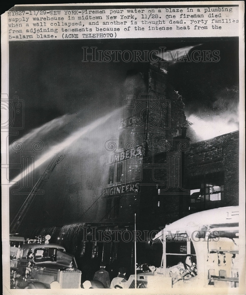 1947 Press Photo Fire at a Plumbing Supply Warehouse, midtown New York City - Historic Images