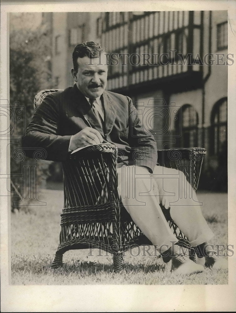 1928 Press Photo Chas Lawrence Sits In Chair - nea88784 - Historic Images