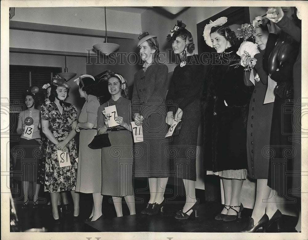 1938 Girls wait in line for judging of hat creations  - Historic Images