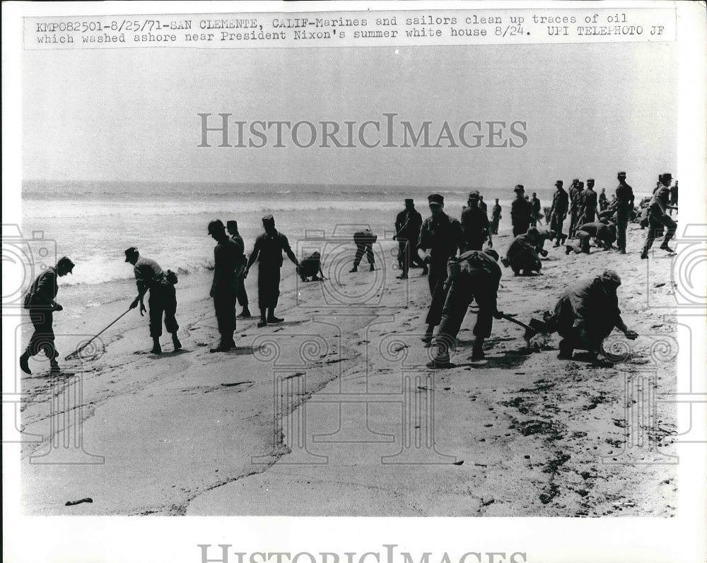 1971 U.S. MArine and Sailors cleaned up traces of oil in Calif. - Historic Images