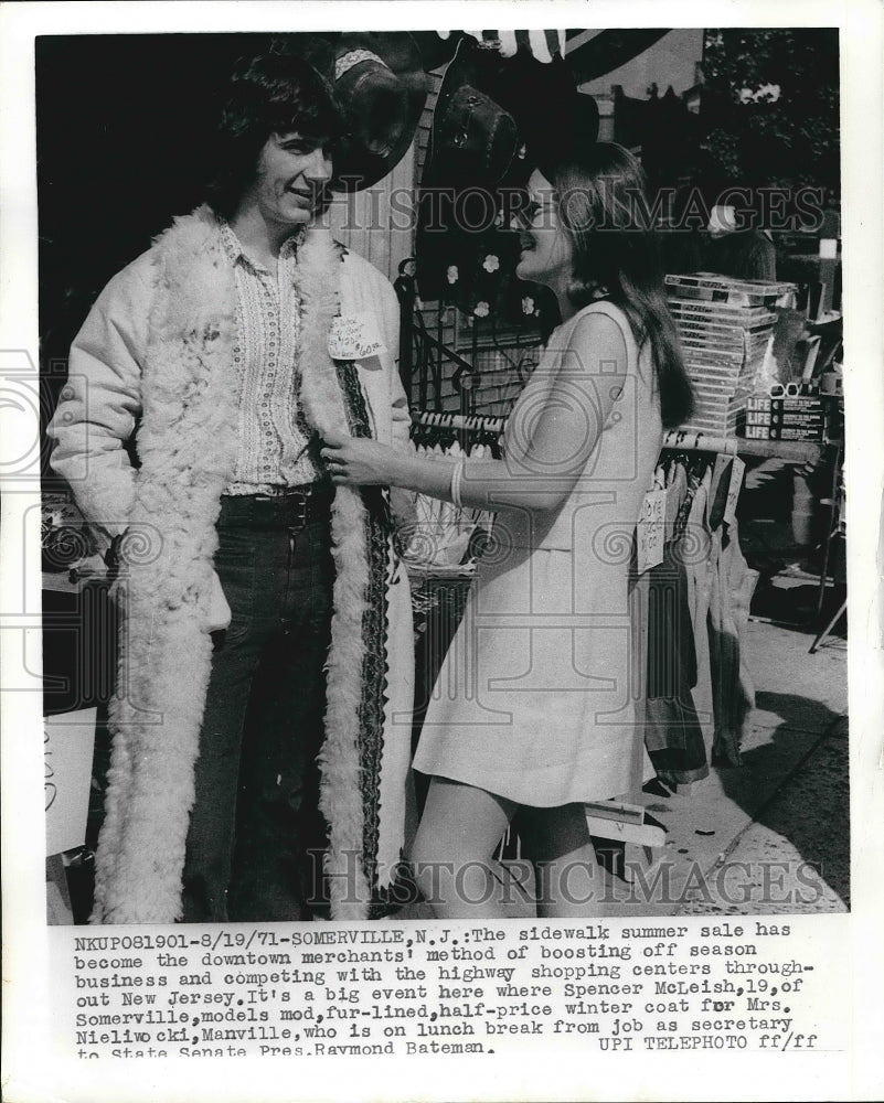 1971 Spencer McLeigh modeling coat for Mrs. Nieliwocki  - Historic Images