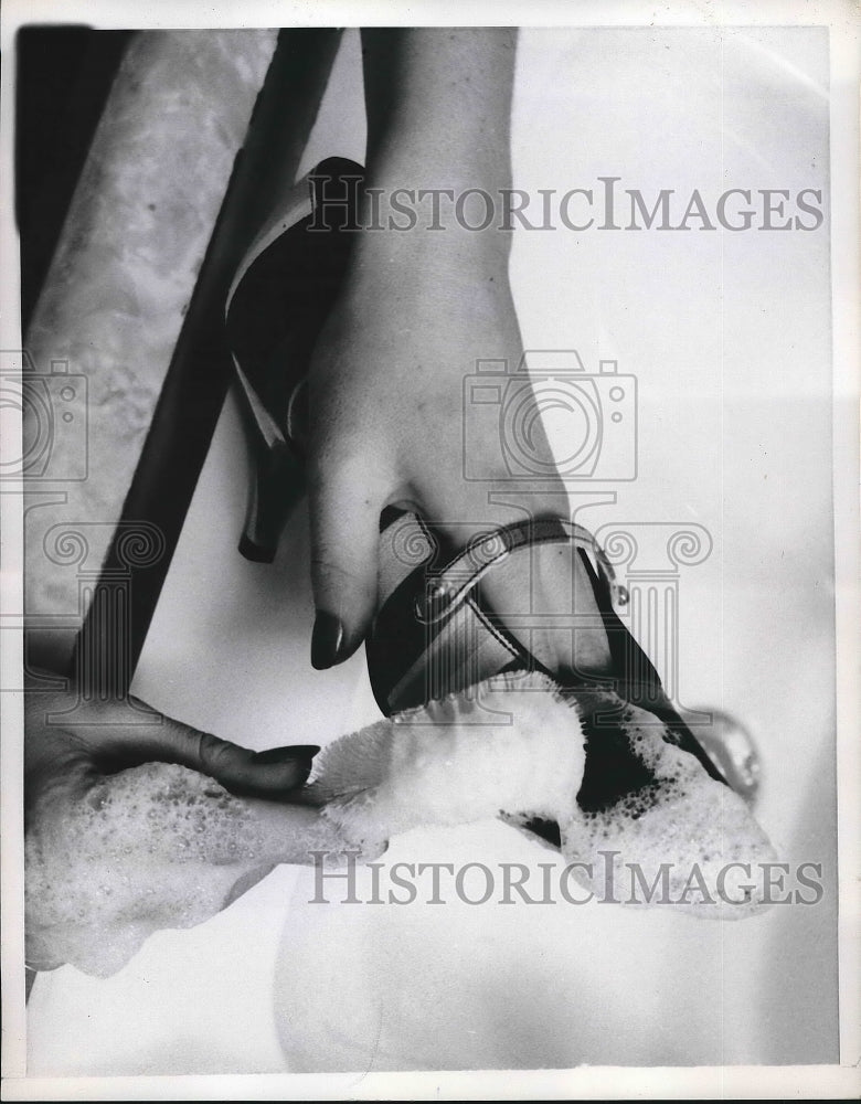 1960 Woman Clears A Pair Of Summer Shoes  - Historic Images