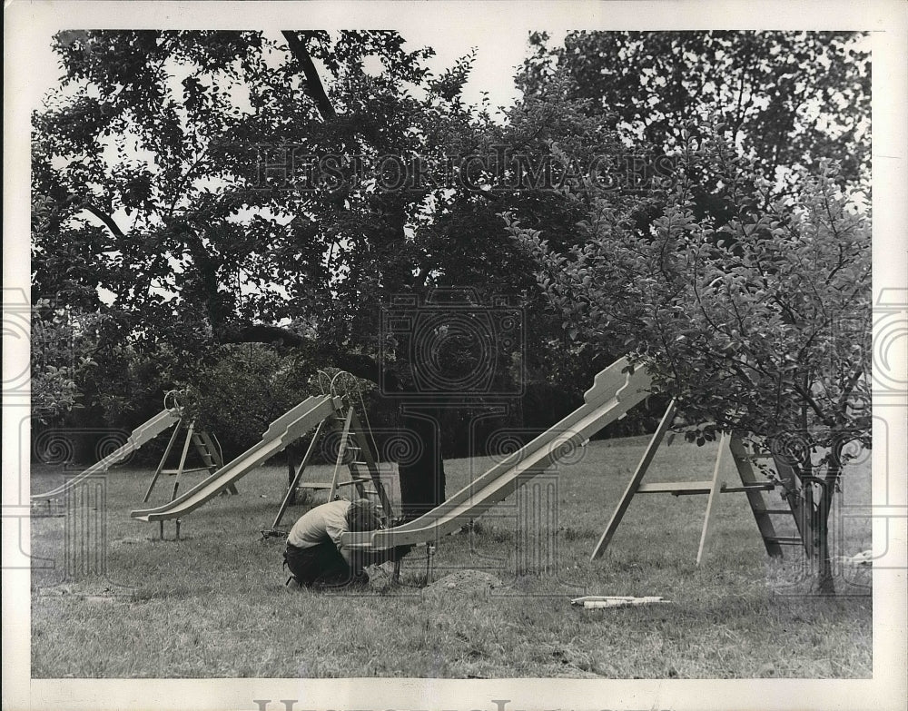 1938 Press Photo Cold Springs, NY worknman sets up playground equipment - Historic Images