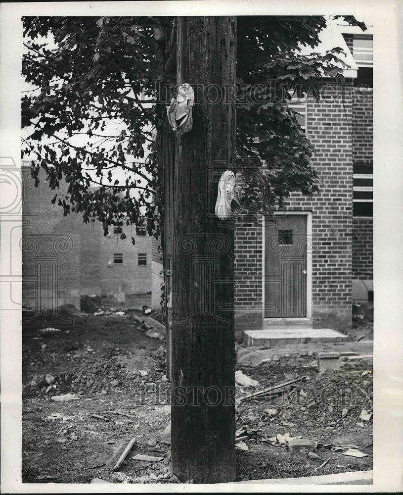 1961 Press Photo Shoes Nailed to Wooden Light Pole, Philadelphia, Pennsylvania - Historic Images
