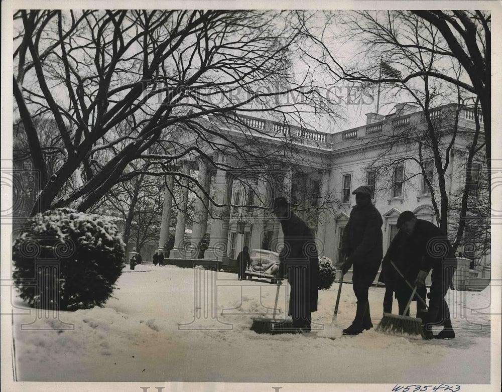 1939 workers sweeping snow from walkway at White House  - Historic Images